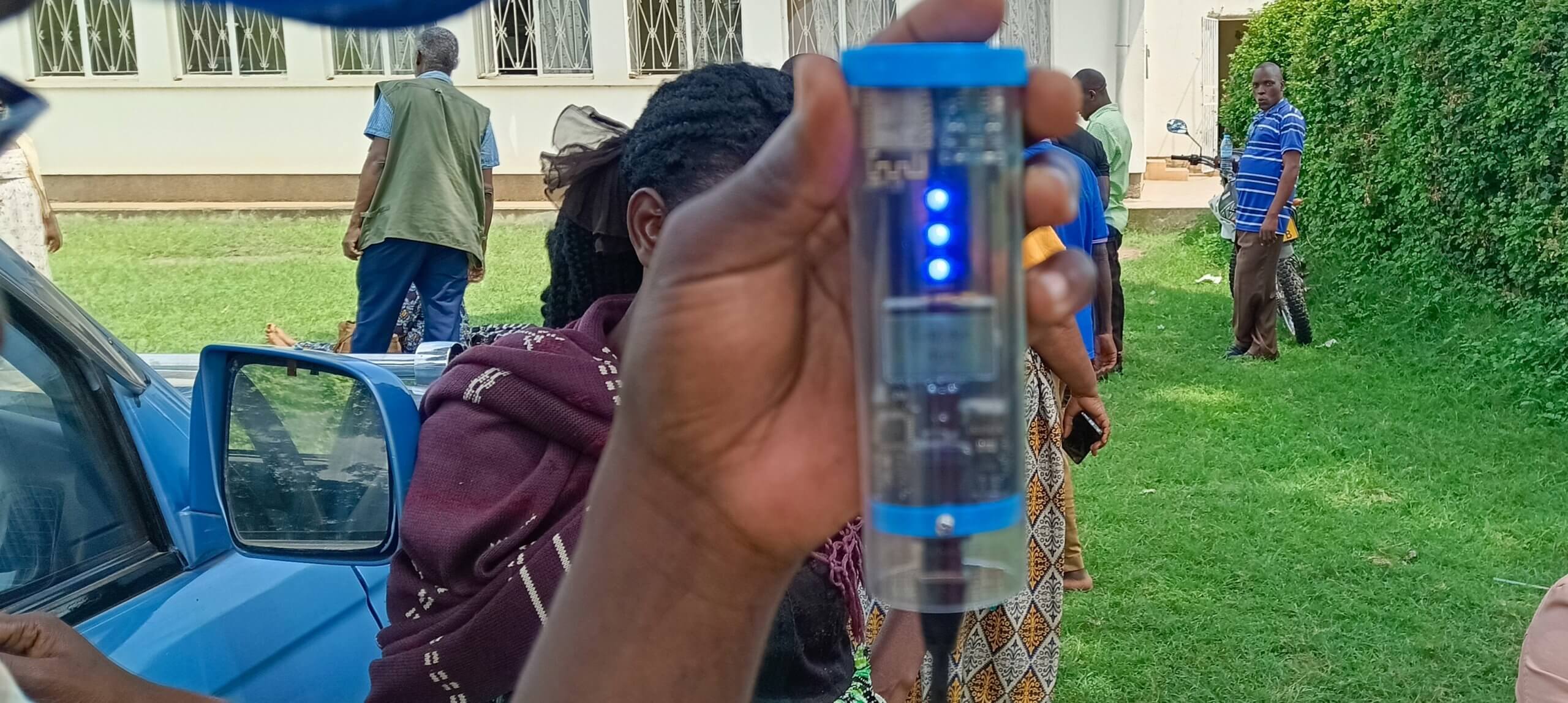 A farmer demonstrates the use of the Chamelon Wiffi reader one of the tools provided to them